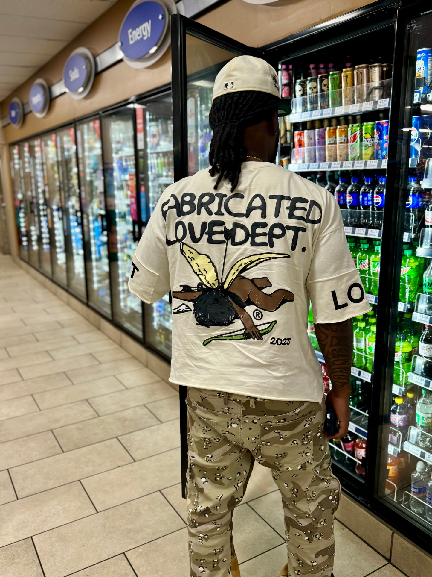 FABRICATED LOVE “NUMBERS DON’T LIE PEOPLE DO” DROP SHOULDER GRAPHIC TEE.