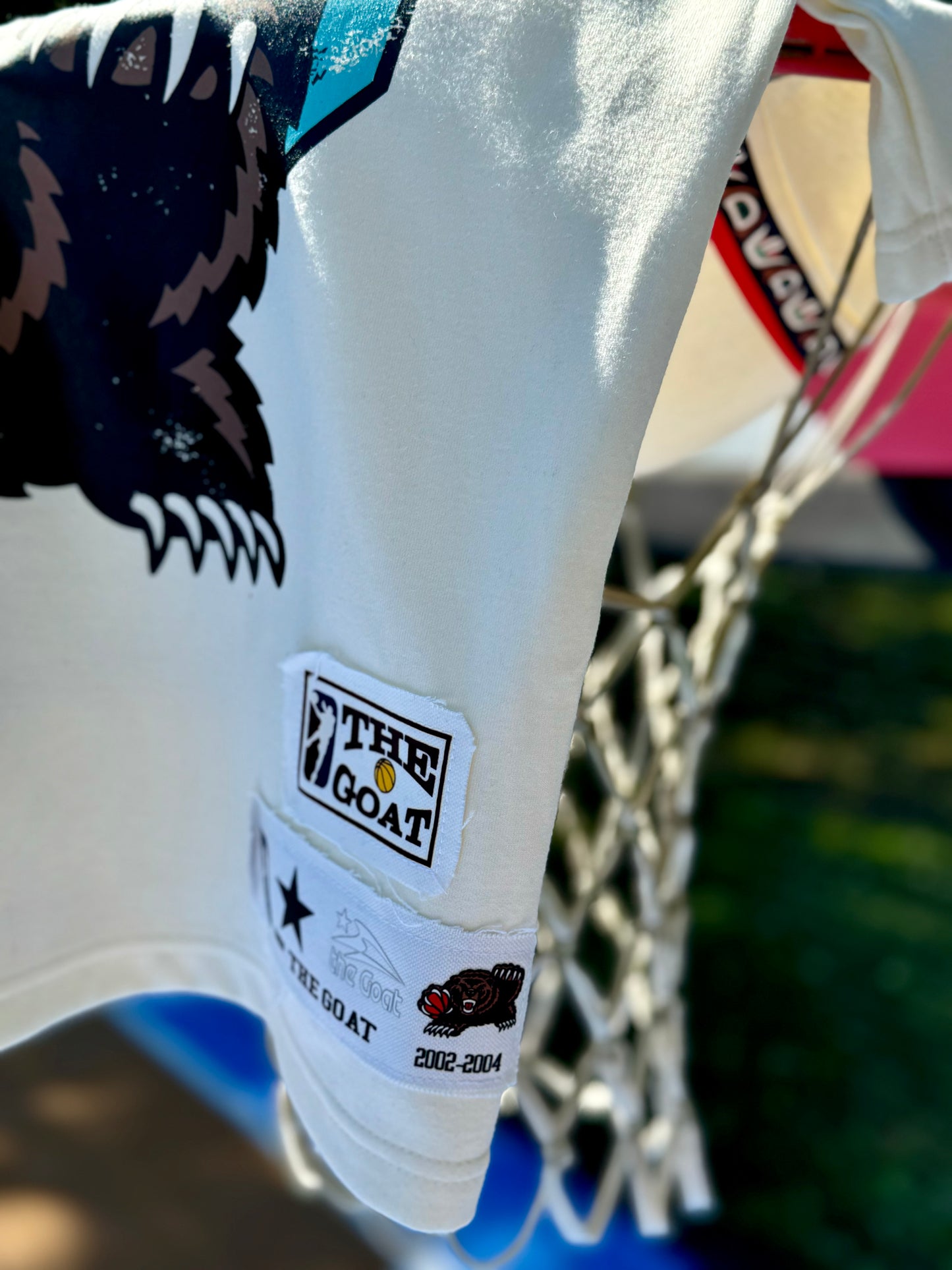 THE GOAT “JA’ MORANT” GRAPHIC PATCHED TEE.