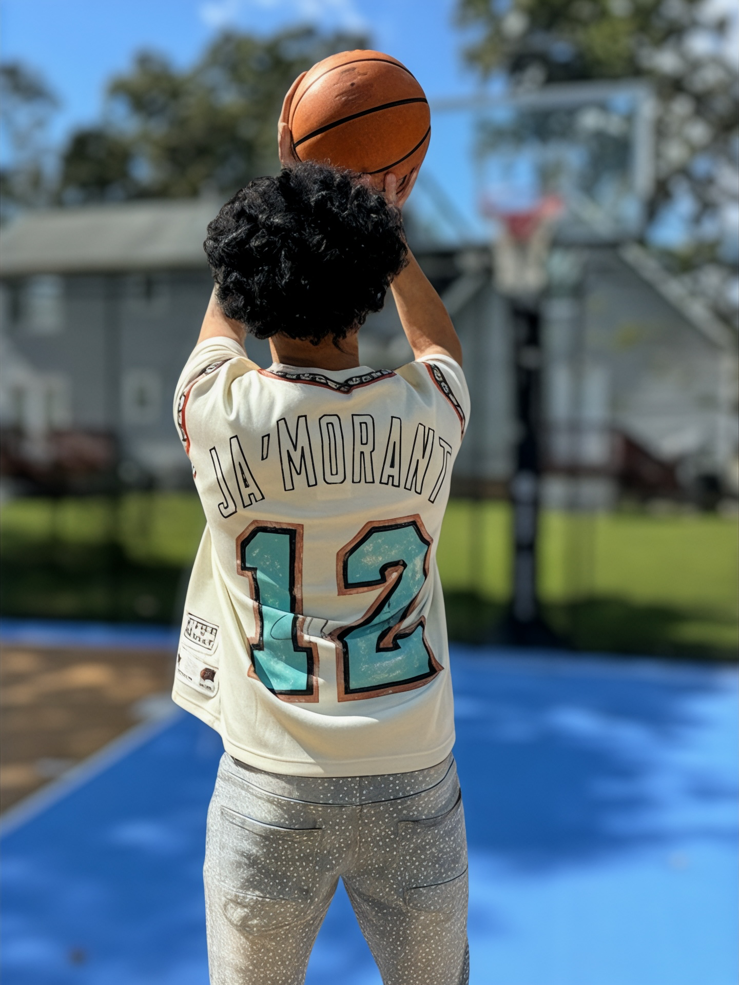 THE GOAT “JA’ MORANT” GRAPHIC PATCHED TEE.