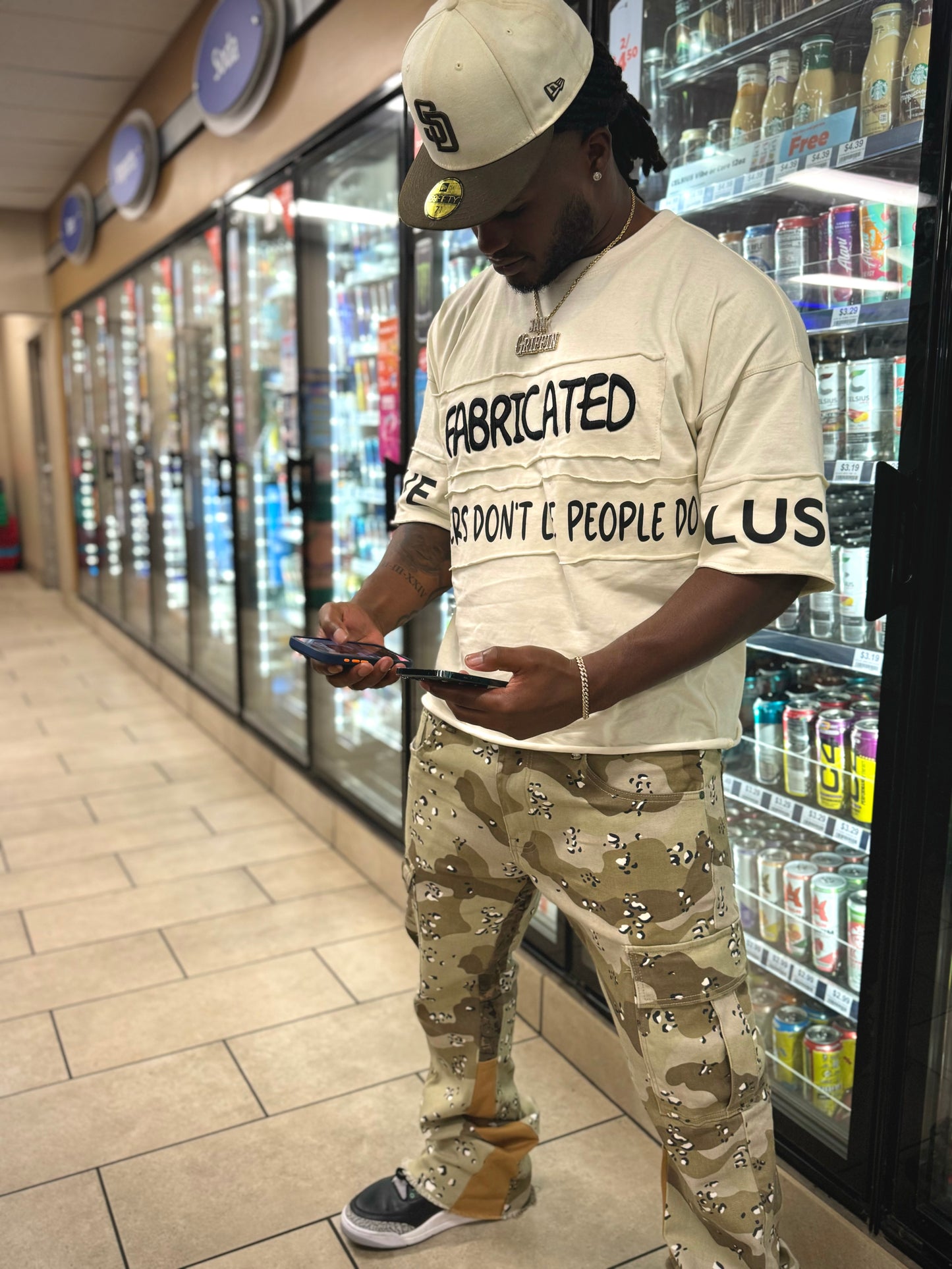 FABRICATED LOVE “NUMBERS DON’T LIE PEOPLE DO” DROP SHOULDER GRAPHIC TEE.