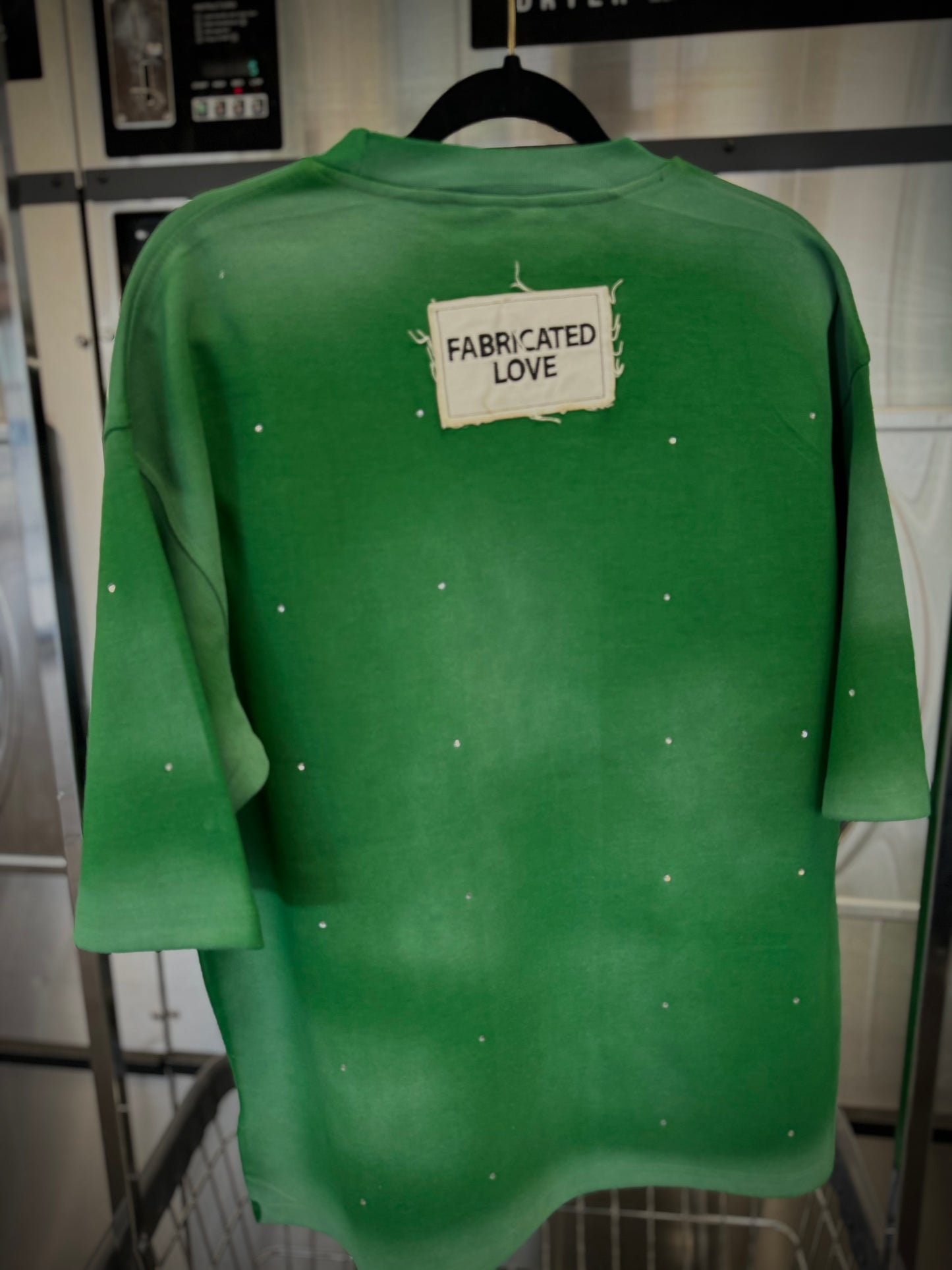 FABRICATED LOVE GREEN & WHITE
“TRUST ISSUES” DROP SHOULD RHINESTONE TEE.