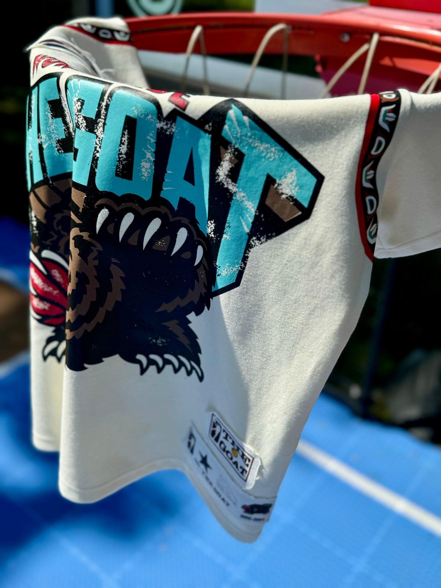 THE GOAT “JA’ MORANT” GRAPHIC PATCHED TEE.