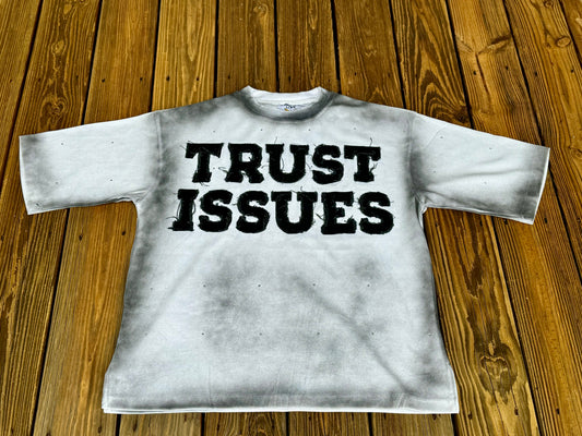 FABRICATED LOVE WHITE & BLACK “TRUST ISSUES” DROP SHOULD RHINESTONE TEE.