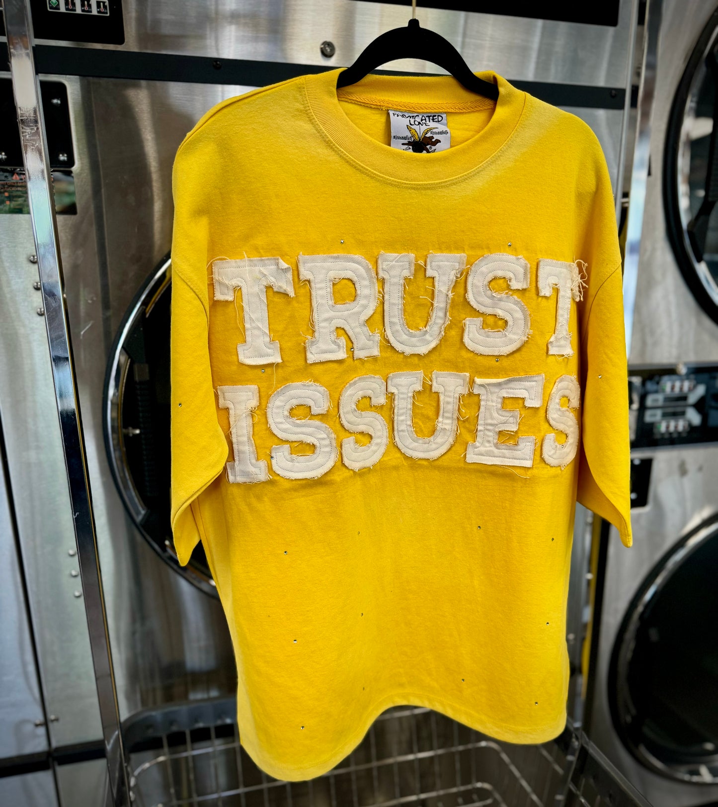 FABRICATED LOVE YELLOW “TRUST ISSUES” Drop shoulder cropped rhinestone Tee