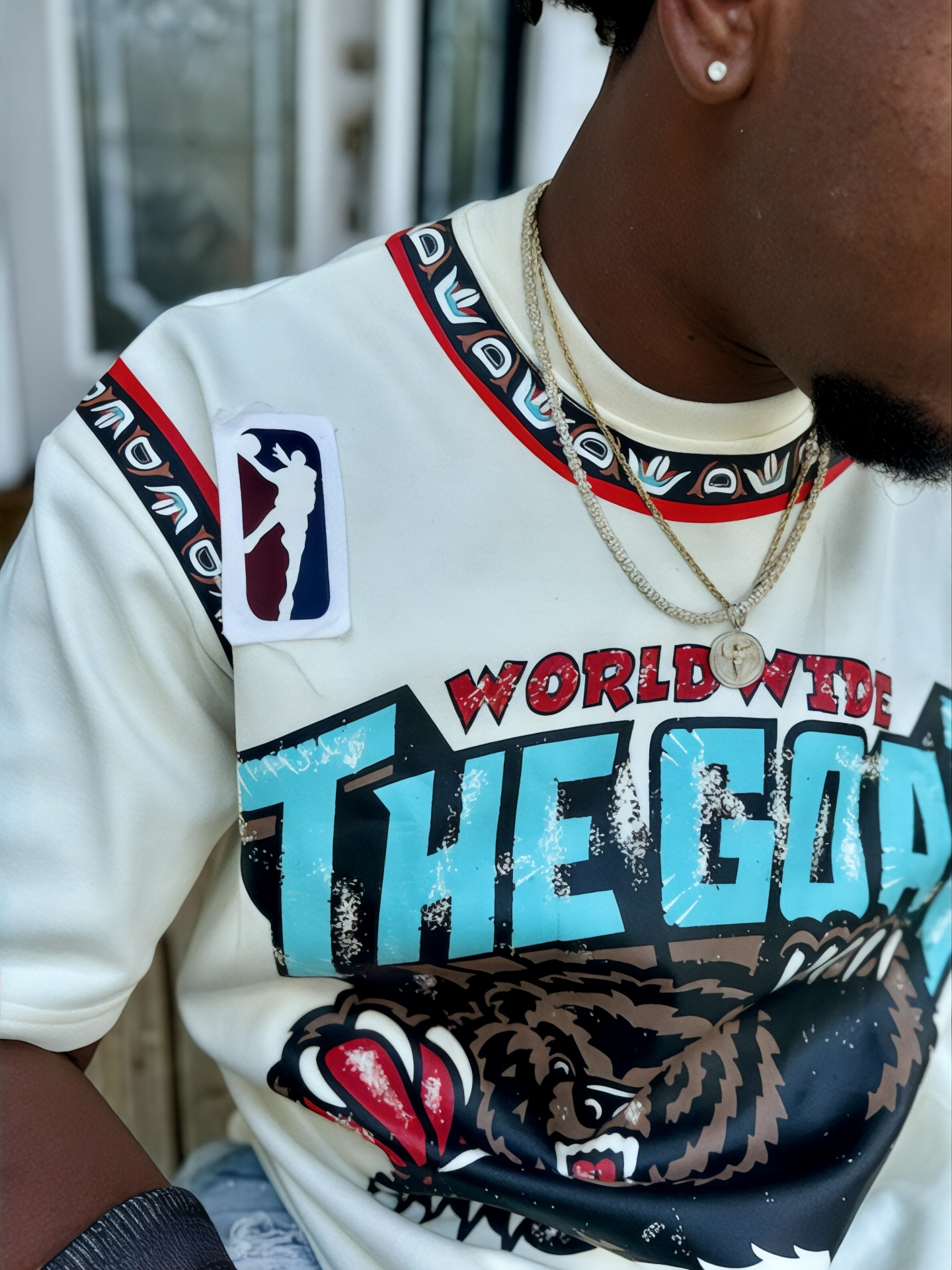 THE GOAT “JA’ MORANT” GRAPHIC PATCHED TEE.