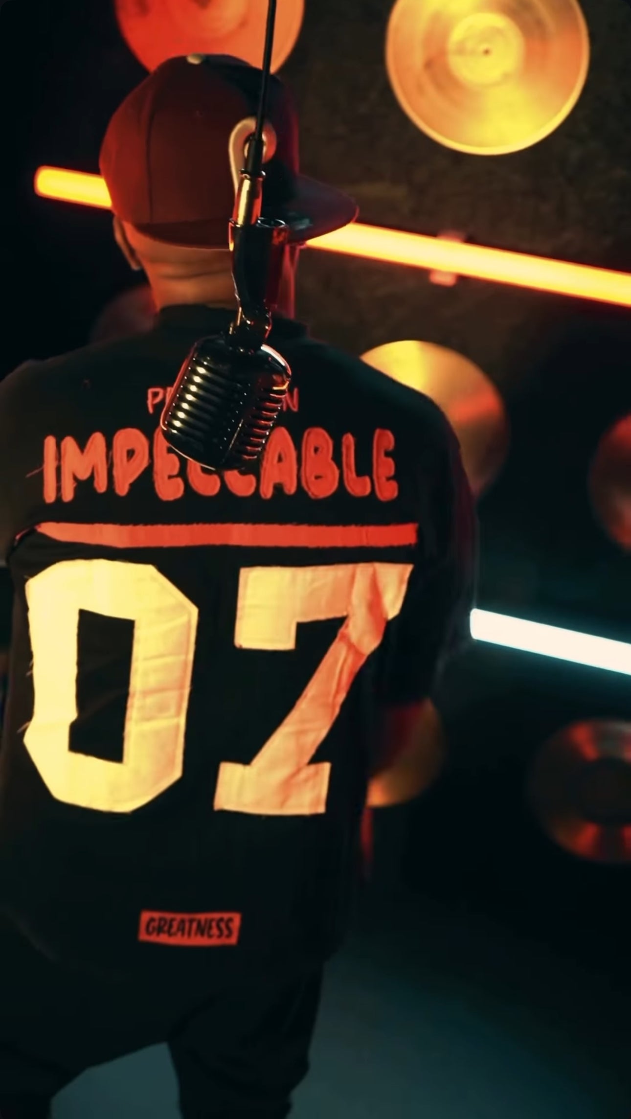 THE G.O.A.T BLACK/FUCHSIA “IMPECCABLE” EMBROIDERY PATCH DROP SHOULDER T-SHIRT