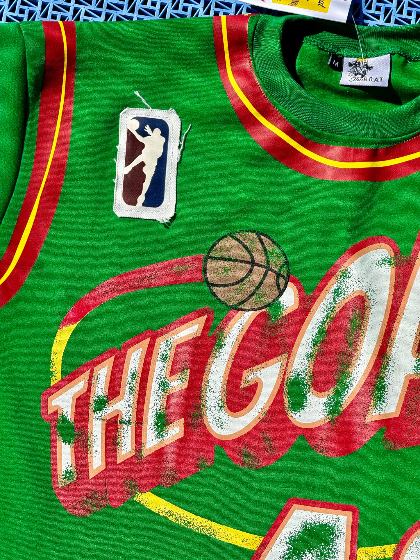 THE GOAT “KEMP” GRAPHIC PATCHED TEE.