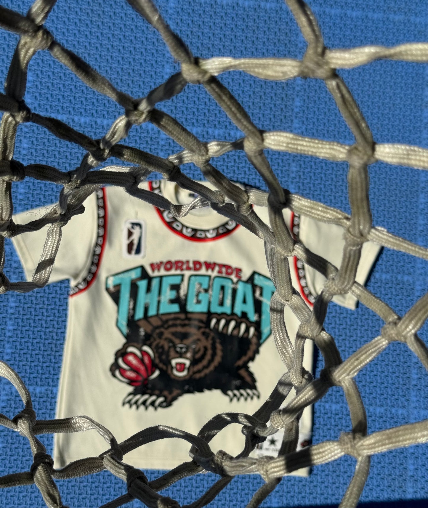 THE GOAT “JA’ MORANT” GRAPHIC PATCHED TEE.