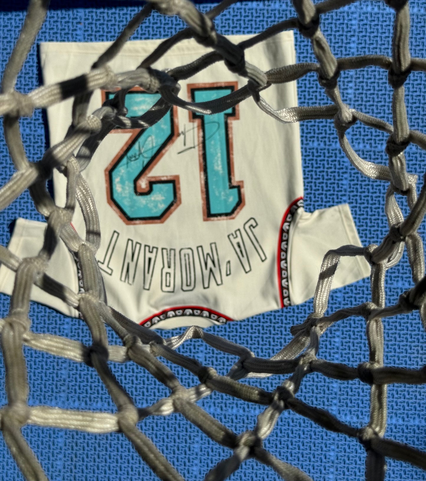 THE GOAT “JA’ MORANT” GRAPHIC PATCHED TEE.