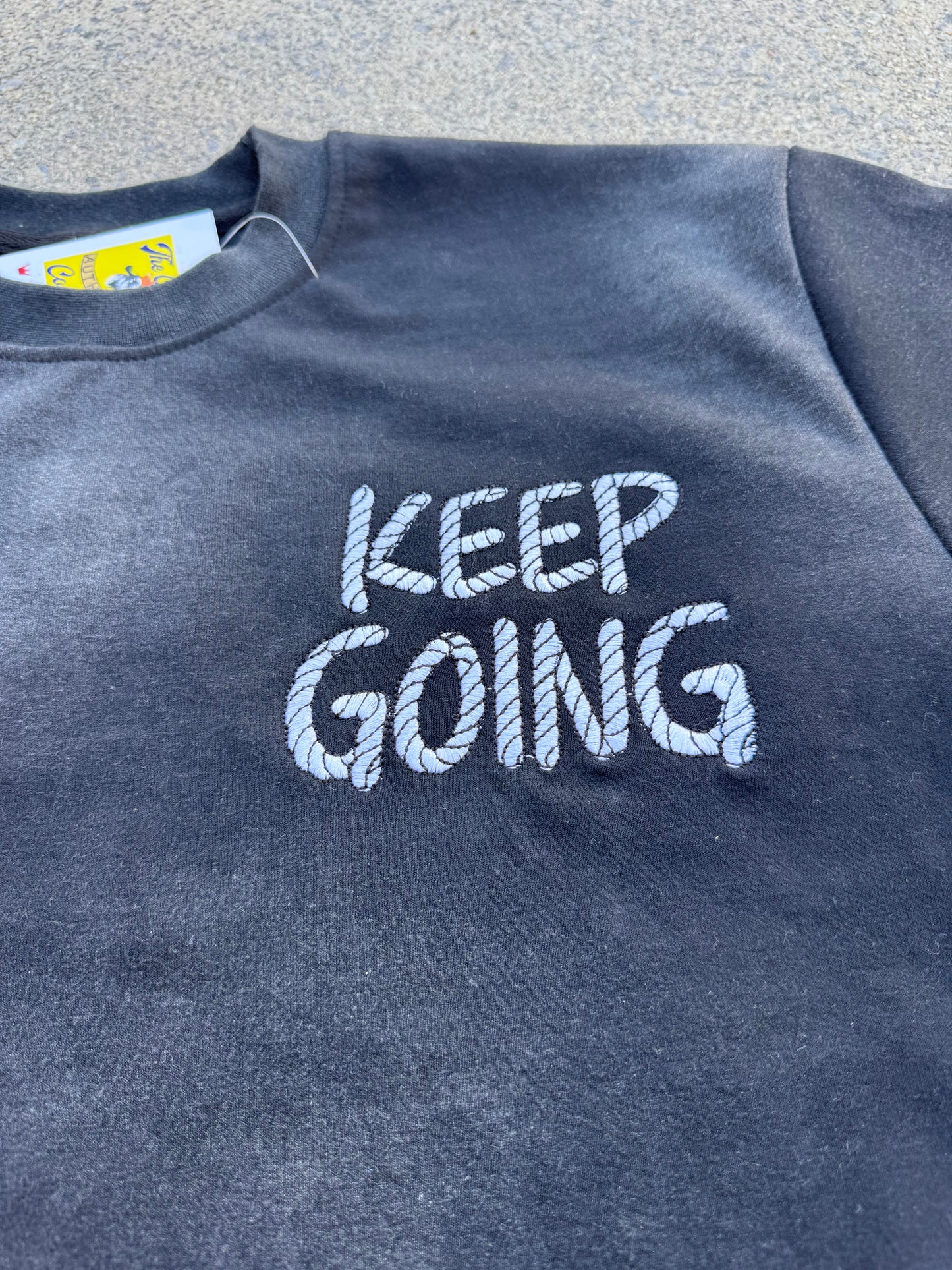 THE GOAT “KEEP GOING” MOTIVATIONAL BLACK ACID WASH T SHIRT